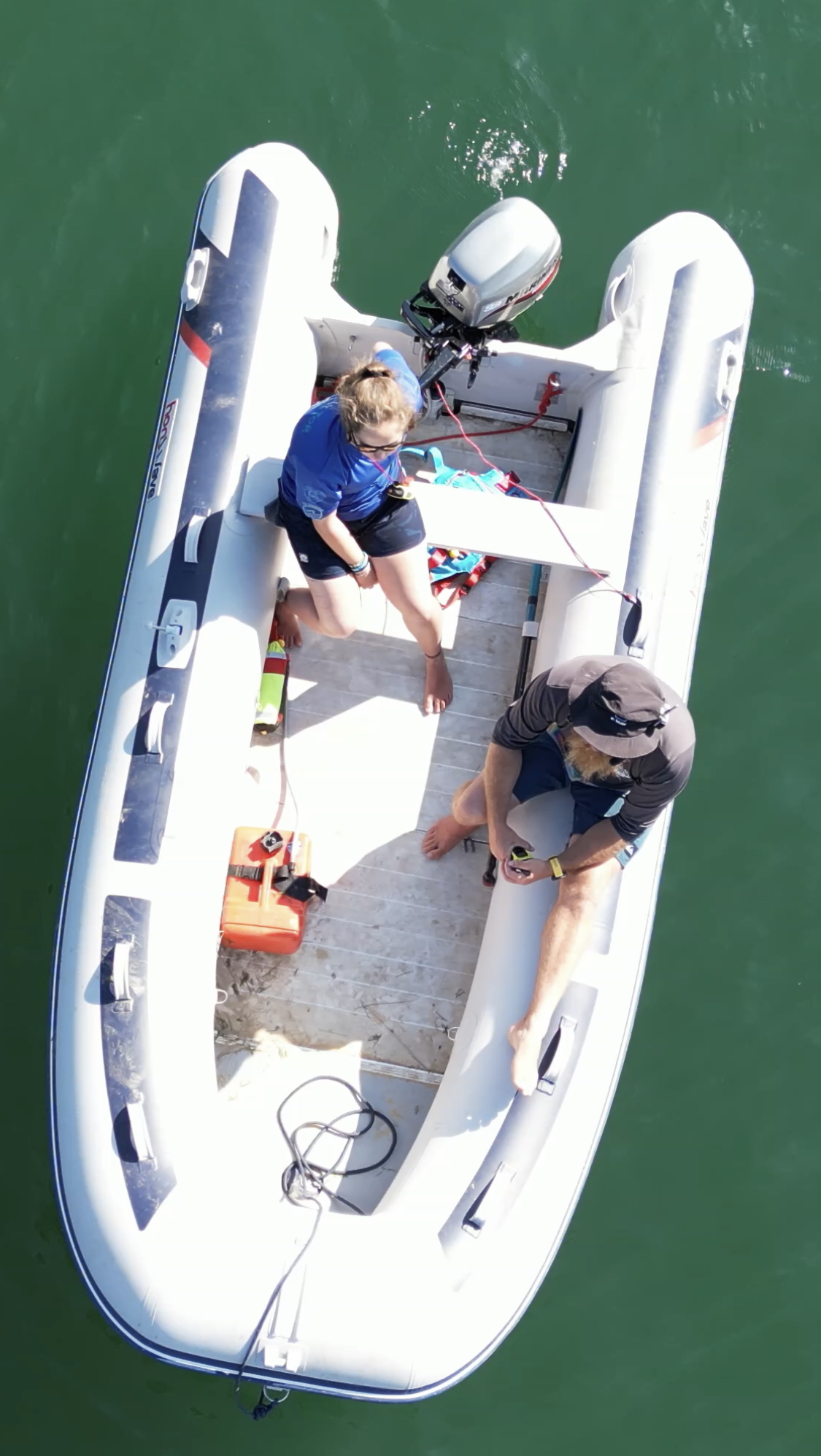 Two practitioners fist-bumping on a safety RIB