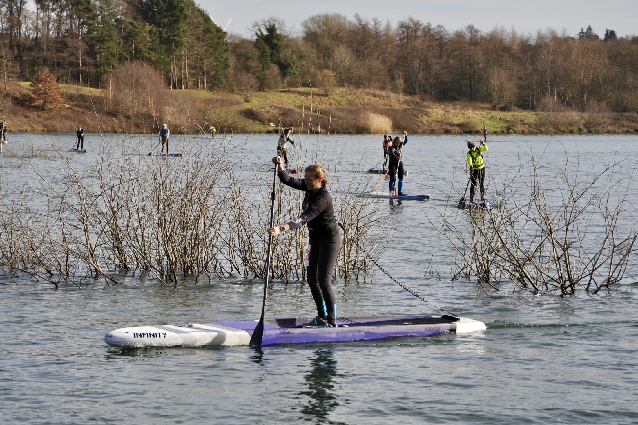 Several paddlers spread across the lake on race and touring boards during GLAGLA UK